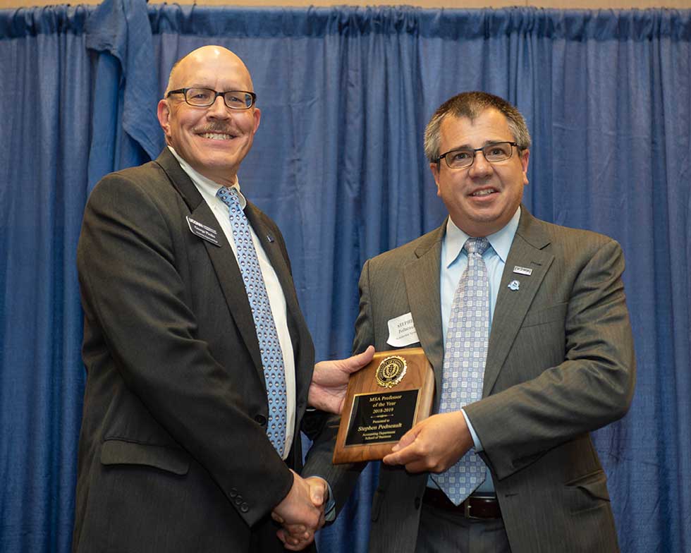 Steve Pednault receiving award from UConn School of Business Accounting Department.